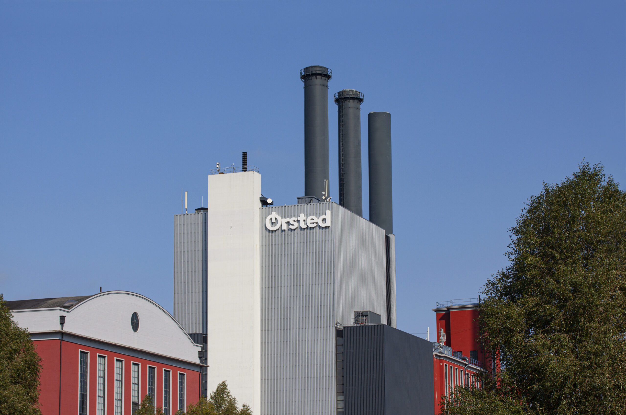 Ørsted Orsted Oersted logotype on building. Danish renewable company power plant factory producing electricity and energy from wind turbines. Copenhagen, Denmark - September 16, 2020